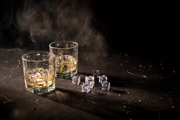 Glass of scotch whiskey on a black background. luxury whiskey. Smoked old fashioned