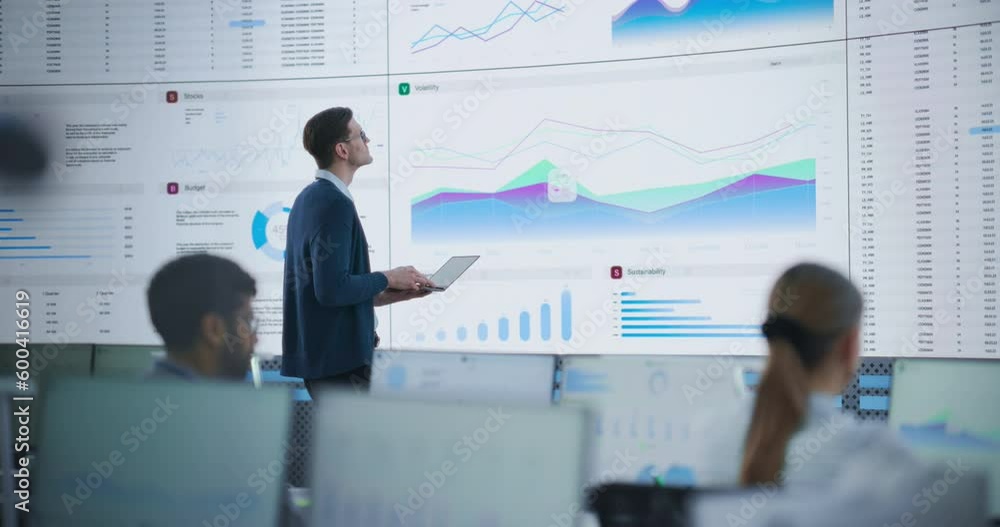 Aufkleber male senior financial analyst reviewing information and reports on big digital screen in modern moni
