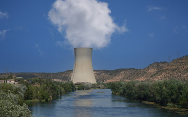Nuclear power plant on the Rio Ebro in Spain with a cooling tower in a nice landscape