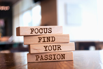 Wooden blocks with words 'Focus, find your passion'.