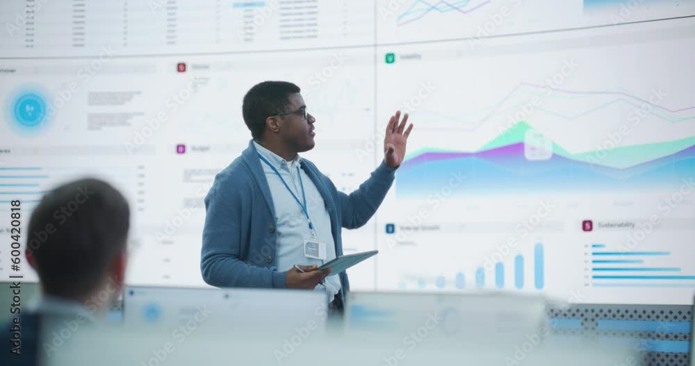 Leinwandbilder black male general manager giving presentation to consulting company employees on big digital screen