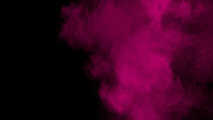 pink smoke thrown into the air on black background
