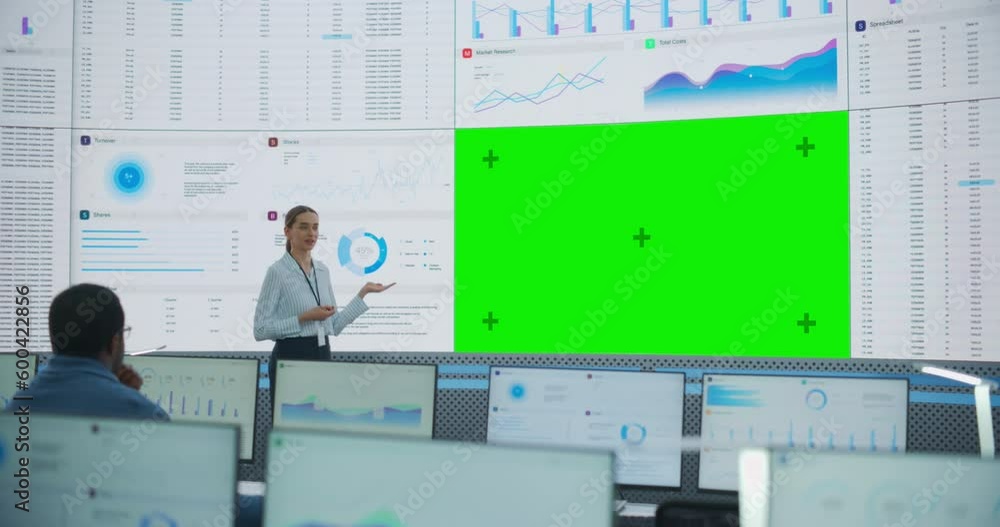 Poster Caucasian Female Data Scientist Giving Presentation On Big Digital Screen With Green Screen Chromakey In Monitoring Office. Team Of Deep Learning Company Employees Listening Behind Desktop Computers.