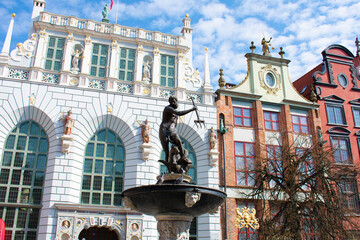 View of the old facades of white and pink buildings with high windows, arches, statues and...