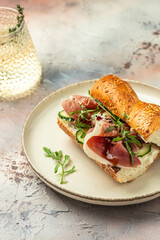 Sandwich with Jamon Serrano and spinach, Cured ham, spanish appetizer. banner, menu, recipe place for text, top view