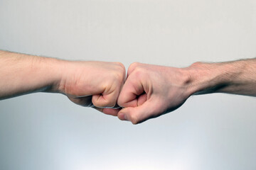 Fist Bump. Clash of two fists. Concept of confrontation