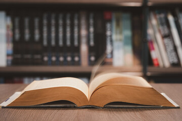 Open book on the table in library. Love read a book. Education learn and knowledge concept. Student study in school or university.