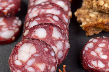 sliced high-quality pork sausage with the addition of lard pieces