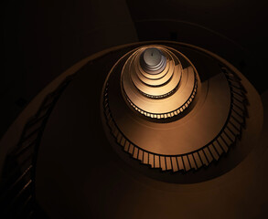 Spiral staircase in a tall multi-floor house, in the form of a "golden ratio", architecture, concert