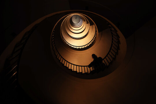 Spiral staircase in a tall multi-floor house, in the form of a "golden ratio", architecture, concert
