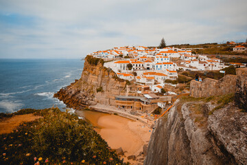 Fototapeta na wymiar Azenhas do Mar is a picturesque seaside village located in the municipality of Sintra, Portugal. It is known for its stunning natural beauty, with houses and buildings built into the cliff