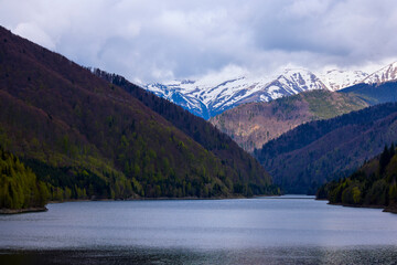landscape with a lake and mountain in the Carpathian mountains of Romania