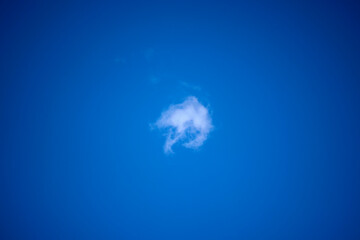 Fototapeta premium landscape with a small cloud on the blue background