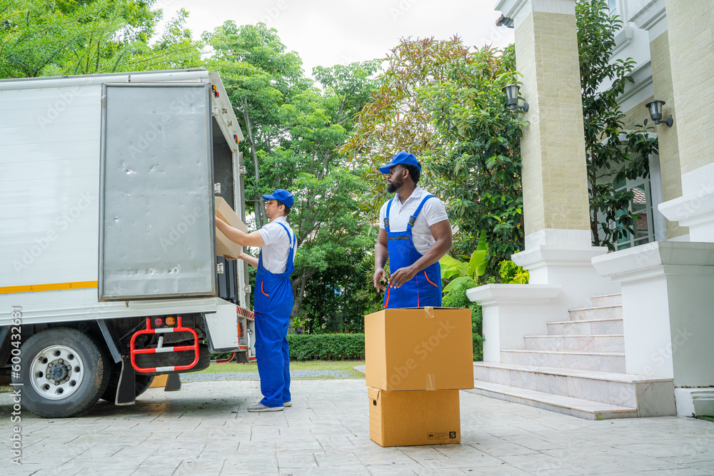 Poster house moving service,homeowner checking delivery list cardboard,moving company employee unloading bo