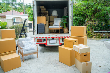 Boxes waiting to be moved into a new home,New home,Moving house day and real estate concept. - obrazy, fototapety, plakaty