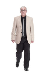 intelligent mature man in a white jacket walking forward .