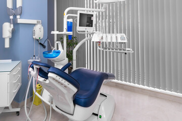 Dentist's office with modern chair and professional equipment. Camera movement around office....