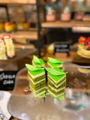 colourful sweet cake dessert - sponge snack at restaurant display.