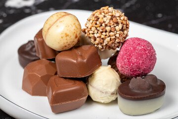 Praline Chocolate. Assorted truffles or praline chocolate on dark background