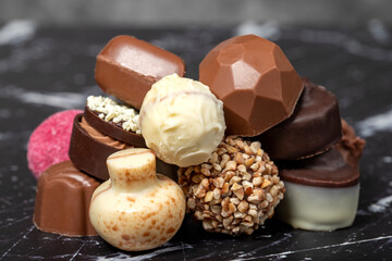 Praline Chocolate. Assorted truffles or praline chocolate on dark background. Close up