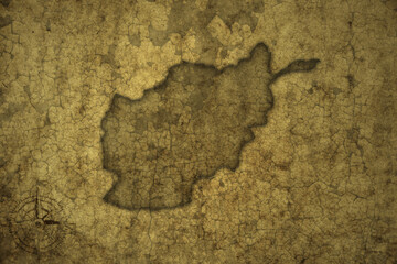 map of afghanistan on a old vintage crack paper background .