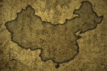map of china on a old vintage crack paper background .