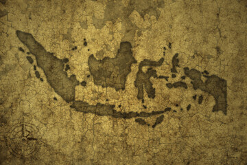 map of indonesia on a old vintage crack paper background .