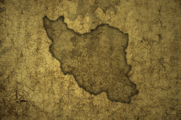 map of iran on a old vintage crack paper background .