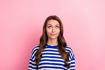 Photo of young satisfied woman wear trendy sailor style shirt looking minded empty space discount store isolated on pink color background
