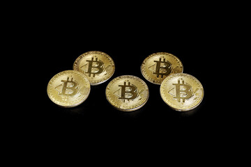gold bitcoin on back background