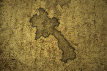 map of laos on a old vintage crack paper background .