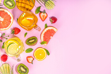 

Set of summer cold lemonade mocktails, with fresh fruits and citrus, tropical leaves and flowers, top view on pink background