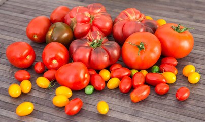 different varieties of ripe red and yellow appetizing tomatoes