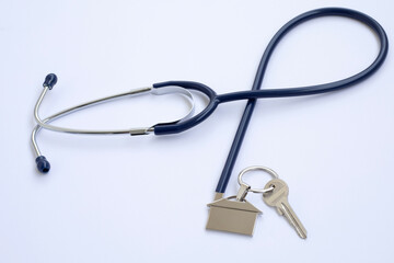 stethoscope checking a home insurance