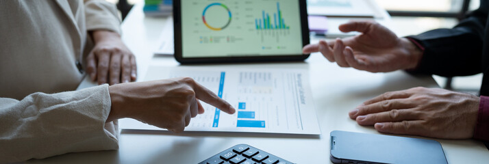 Business team meeting to discuss and analyze statistical data presented in the form of digital graphs and charts. New business ideas in the online world.