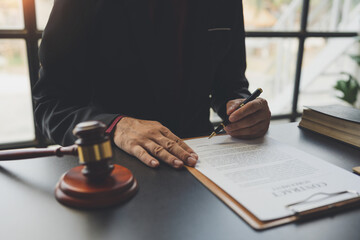 Attorneys or lawyers who are reading the statute of limitations Consultation between male lawyers and business clients, tax and legal and legal services firms.
