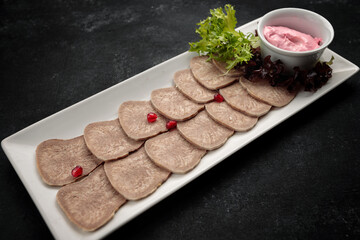 Boiled and sliced beef tongue with lettuce and mayonnaise, banquet food