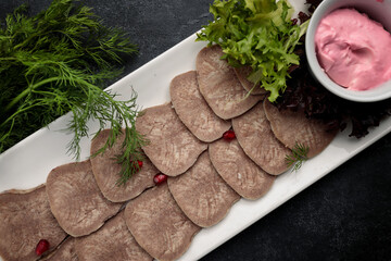 Boiled and sliced beef tongue with lettuce and mayonnaise, banquet food