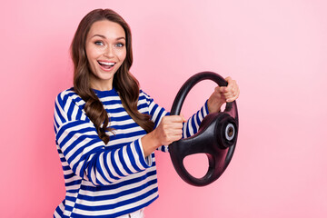 Photo of beautiful young lady wear striped blue shirt hold steering wheel audi new insurance rent cars isolated on pink color background