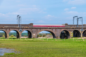 A view of the Irchester viaduct spanning the River Nene near Wellingborough UK in the early summer