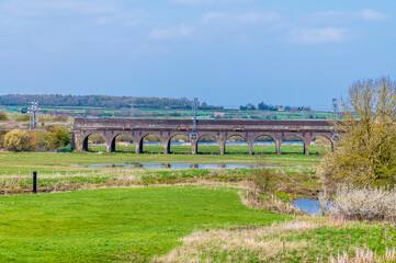 A view across the fields towards the Irchester viaduct near Wellingborough UK in the early summer