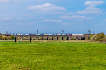 A view over the River Nene towards the Irchester viaduct near Wellingborough UK in the early summer