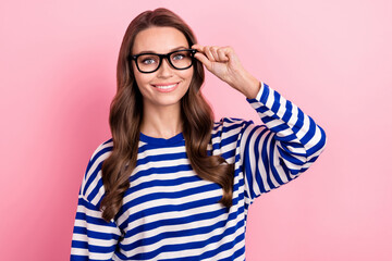 Photo of young business lady wear striped blue shirt touch eyeglasses experienced financial topic isolated on pink color background