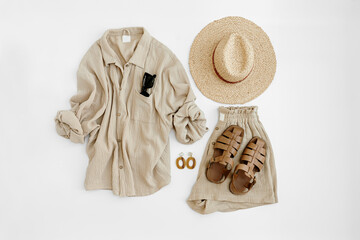 Aesthetic summer fashion composition with neutral beige female clothes and accessories. Muslin tee...