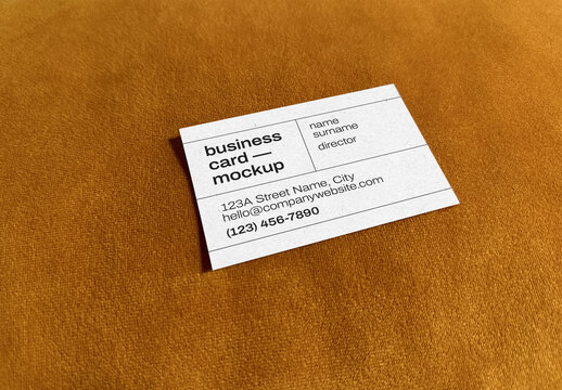 Simple Business Card Mockup &ndash; Top View on Warm Ochre Suede Fabric