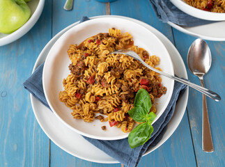 Beef and pasta with vegetables on a plate