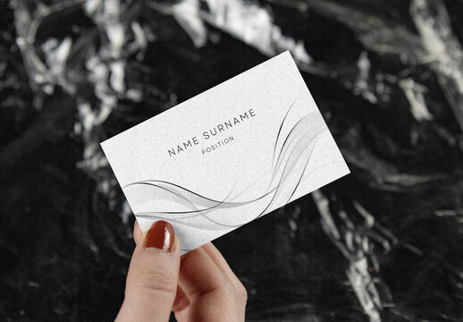 Minimalist Business Card Mockup &ndash; Hand-Held Design with Reflective Crinkled Plastic Background