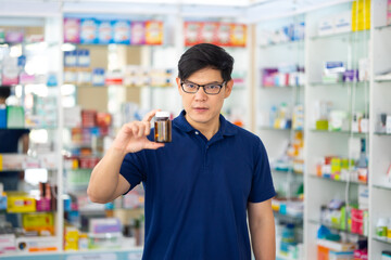 Pharmacy Drugstore. Portrait handsome man buy medicine at pharma store. Health and wellness center