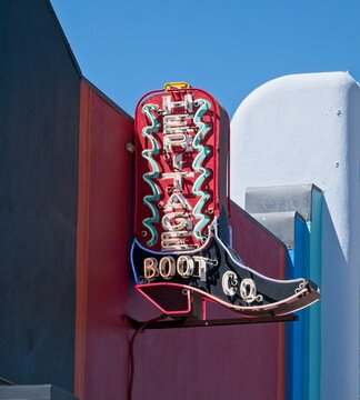 Vertical boot neon sign of the iconic Heritage Boot Company on South Congress Avenue in Austin, Texas