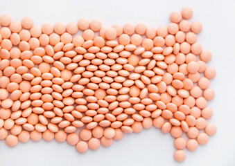Pink pills on white background. Vitamins, health supplements. Internet pharmacy. 